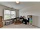 Bright home office featuring a large window, desk, chair and shelving for storage at 1200 Bar Harbor Pl, Lawrenceville, GA 30044