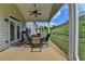 Covered patio with a table and chairs, perfect for outdoor dining and entertaining at 1200 Bar Harbor Pl, Lawrenceville, GA 30044