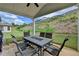 Covered patio with a dining table and chairs offers a comfortable outdoor living space at 1200 Bar Harbor Pl, Lawrenceville, GA 30044