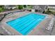Aerial view of the community pool, featuring lounge chairs and a clubhouse at 1200 Bar Harbor Pl, Lawrenceville, GA 30044