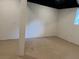 Unfinished basement with concrete flooring and a small window at 279 Fairview Dr, Dallas, GA 30157