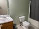 Bathroom featuring a single sink vanity and a shower with a gray curtain at 279 Fairview Dr, Dallas, GA 30157
