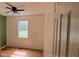 Bright bedroom featuring a window, ceiling fan, hardwood floors, and neutral wall colors at 279 Fairview Dr, Dallas, GA 30157