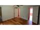 Spacious bedroom with hardwood floors, white doors, and views to additional rooms at 279 Fairview Dr, Dallas, GA 30157