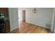 Dining area showcasing new light fixture and light hardwood floors at 279 Fairview Dr, Dallas, GA 30157