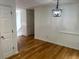 Dining room offers hardwood floors and modern lighting fixtures at 279 Fairview Dr, Dallas, GA 30157