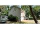 View of a home featuring a two car garage, side stairs, and vinyl siding at 279 Fairview Dr, Dallas, GA 30157