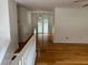 An open hallway with hardwood floors leads to the living area at 279 Fairview Dr, Dallas, GA 30157