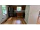 Spacious kitchen with stainless steel appliances, wood cabinets, granite counters, and hardwood floors at 279 Fairview Dr, Dallas, GA 30157