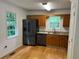 Efficient kitchen with stainless steel refrigerator, dishwasher and breakfast area near bright window at 279 Fairview Dr, Dallas, GA 30157