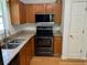 Compact kitchen with wood cabinets, stainless steel appliances and granite countertops at 279 Fairview Dr, Dallas, GA 30157