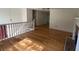 Spacious living room featuring hardwood floors, staircase, and ample natural light at 279 Fairview Dr, Dallas, GA 30157