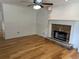 Spacious living room featuring a stone fireplace and hardwood floors at 279 Fairview Dr, Dallas, GA 30157