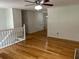 Open-concept living room featuring hardwood floors and a ceiling fan at 279 Fairview Dr, Dallas, GA 30157