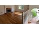 Living room featuring a stone fireplace, hardwood floors, and a large window at 279 Fairview Dr, Dallas, GA 30157