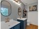 Charming bathroom with double vanity, framed mirrors, and modern fixtures at 4053 Five Oaks Ct, Powder Springs, GA 30127