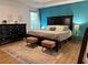Well-decorated main bedroom suite with a large bed, and wood flooring at 4053 Five Oaks Ct, Powder Springs, GA 30127