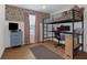 Bright bedroom design featuring a loft bed, desk, and blue accent furniture at 4053 Five Oaks Ct, Powder Springs, GA 30127