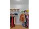 Organized walk-in closet with shelving and hanging rods for ample storage at 4053 Five Oaks Ct, Powder Springs, GA 30127