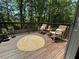 View of the wooden deck featuring chairs and an outdoor rug at 4053 Five Oaks Ct, Powder Springs, GA 30127