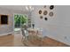Cozy dining area with decorative wall plates and sliding glass door to deck at 4053 Five Oaks Ct, Powder Springs, GA 30127