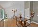 Bright dining area featuring a chandelier, round table, and decoratively adorned walls at 4053 Five Oaks Ct, Powder Springs, GA 30127