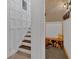 Entryway with wood-paneled walls, stairs, and a shoe storage bench at 4053 Five Oaks Ct, Powder Springs, GA 30127