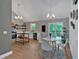 Modern kitchen and dining area with stainless steel appliances and updated lighting at 4053 Five Oaks Ct, Powder Springs, GA 30127