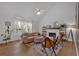 Sunlit living room features vaulted ceiling, fireplace, stylish seating, and large windows at 4053 Five Oaks Ct, Powder Springs, GA 30127