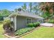 Landscaped backyard featuring a well-maintained lawn and a patio area for outdoor enjoyment at 703 Kirkwood Cir, Woodstock, GA 30189
