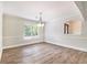 Bright dining room with modern flooring and natural light, perfect for hosting gatherings at 703 Kirkwood Cir, Woodstock, GA 30189