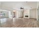Inviting living area featuring a fireplace, modern flooring, and seamless transition to the entryway at 703 Kirkwood Cir, Woodstock, GA 30189