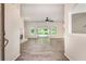 Bright living room featuring modern flooring, a cozy fireplace, and sliding glass doors for natural light at 703 Kirkwood Cir, Woodstock, GA 30189