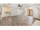 Open-concept living space with modern flooring, recessed lighting, and seamless flow to the kitchen at 703 Kirkwood Cir, Woodstock, GA 30189
