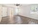 Main bedroom with ceiling fan, wood-look floors, and ensuite bathroom access at 703 Kirkwood Cir, Woodstock, GA 30189