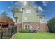 Back exterior of home with fenced in yard and partial view of deck at 192 Chicopee Dr, Marietta, GA 30060