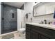 Modern bathroom featuring a tiled shower with a glass enclosure and white marble counter at 192 Chicopee Dr, Marietta, GA 30060