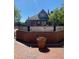 Garden landscape with a brick wall and historical markers and a beautiful brick building at 192 Chicopee Dr, Marietta, GA 30060