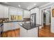Open kitchen featuring an island, stainless steel appliances, and hardwood floors at 192 Chicopee Dr, Marietta, GA 30060