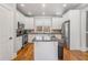 Modern kitchen with an island, stainless steel appliances, and decorative backsplash at 192 Chicopee Dr, Marietta, GA 30060