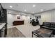Open basement with modern kitchenette and living space with recessed lighting at 192 Chicopee Dr, Marietta, GA 30060