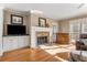 Living room features hardwood floors, a fireplace, built-in cabinets, and plantation shutters for a bright and inviting space at 192 Chicopee Dr, Marietta, GA 30060