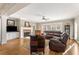 Spacious living room with hardwood floors, fireplace, and comfortable leather seating at 192 Chicopee Dr, Marietta, GA 30060