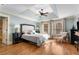 Spacious main bedroom with hardwood floors, ceiling fan, and tray ceiling at 192 Chicopee Dr, Marietta, GA 30060