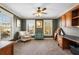 Spacious office with windows, custom built-ins, and a ceiling fan at 192 Chicopee Dr, Marietta, GA 30060