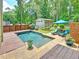 Beautiful backyard pool with lounge chairs and a privacy fence with mature landscaping at 192 Chicopee Dr, Marietta, GA 30060
