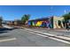 Railroad tracks with a colorful mural and a building in the background on a clear day at 192 Chicopee Dr, Marietta, GA 30060