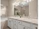 Bathroom with double vanity, large mirror, soaking tub, and updated fixtures at 2303 Waters Edge Trl, Roswell, GA 30075