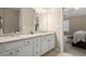 Well-lit bathroom with double vanity, granite countertops, and neutral color scheme at 2303 Waters Edge Trl, Roswell, GA 30075