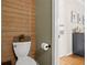 Charming bathroom with wooden accent wall, toilet and view to connecting room at 2303 Waters Edge Trl, Roswell, GA 30075